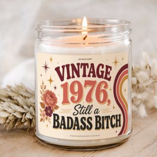 Vintage 1976 Still a Badass Bitch birthday candle with retro coral, burgundy, gold, floral, star, and rainbow artwork for a funny birthday gift for women born in 1976.