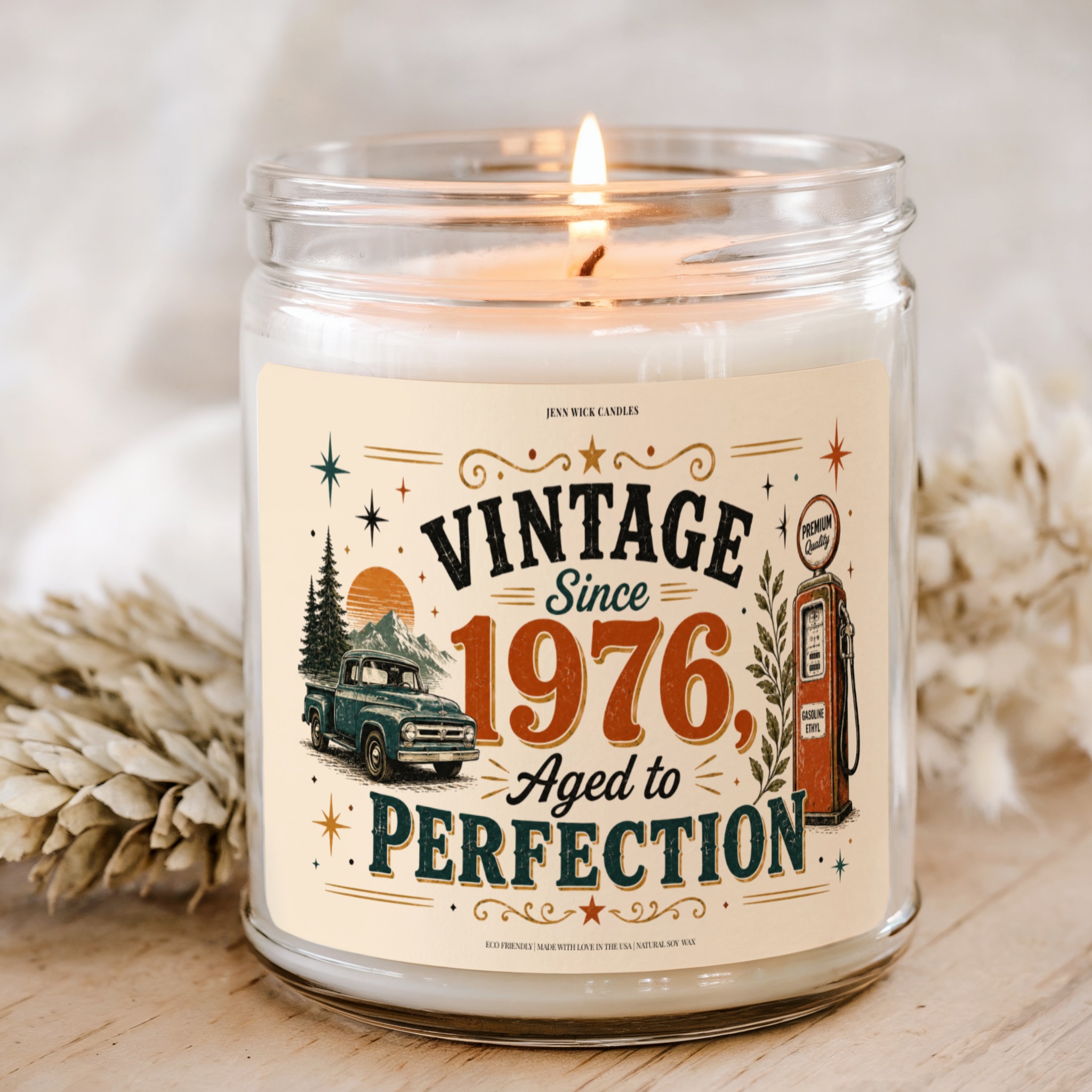 Vintage Since 1976 Aged to Perfection Candle 1 Vintage Since 1976 Aged to Perfection 9 oz soy candle with retro truck, mountain sunset, vintage gas pump, stars, and rustic orange green typography.