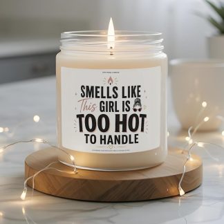 Funny “Smells Like This Girl Is Too Hot To Handle” 9 oz soy candle label with bold black lettering, blush accents, and sassy feminine gift design.